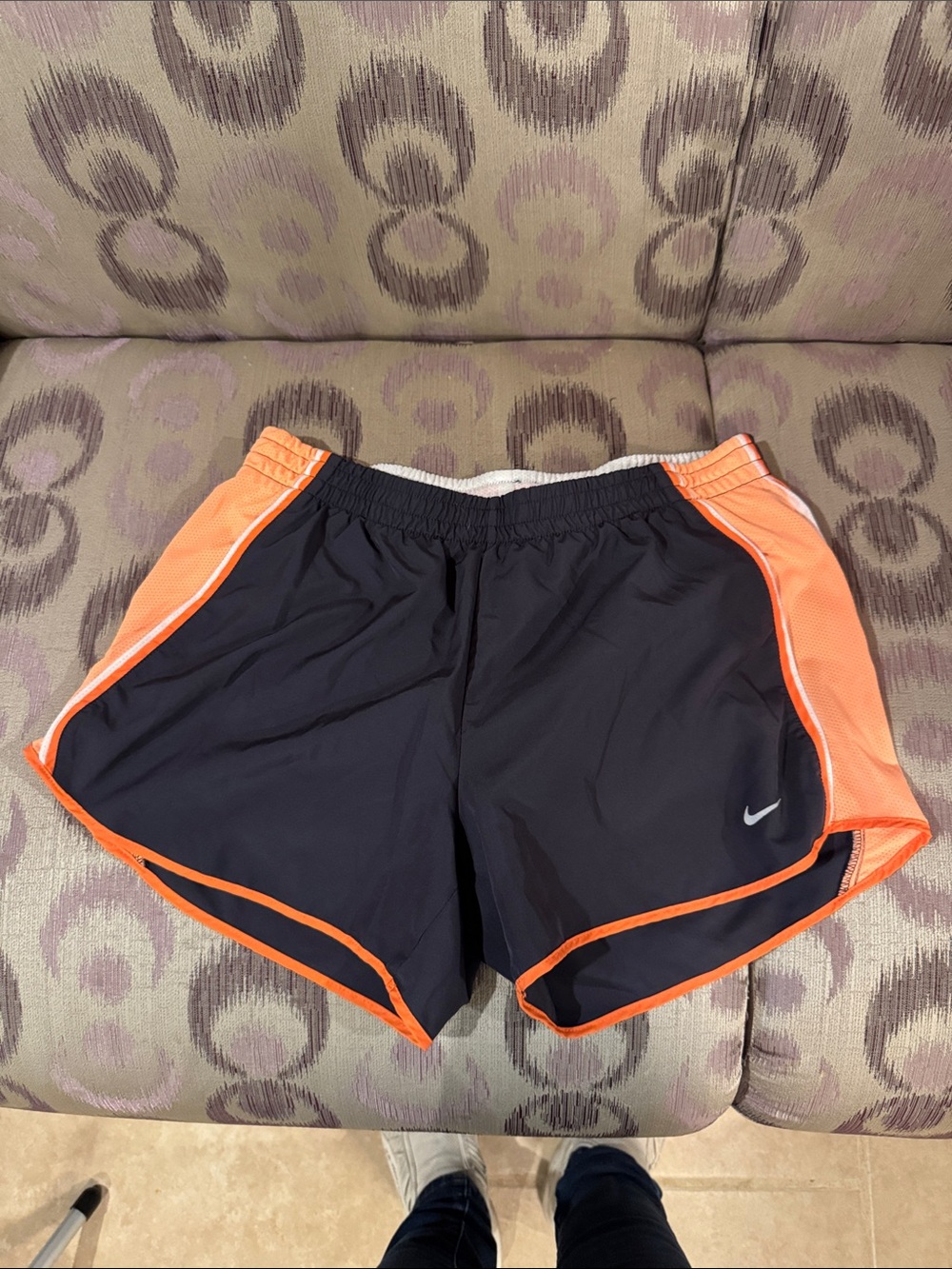 Nike Women’s Black Athletic Shorts with Orange Trim